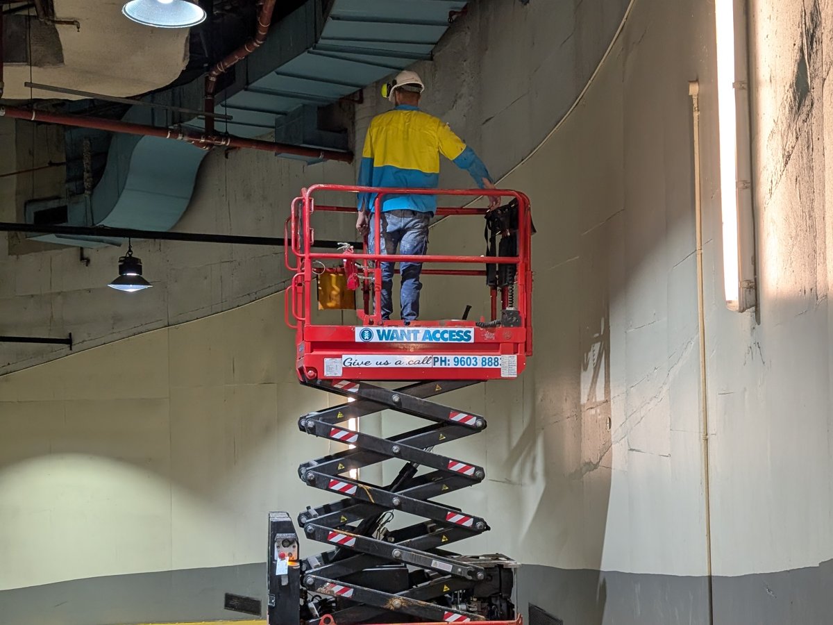 Worker on scissor lift, The Malaya